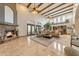Spacious living room showcasing beamed ceilings, a fireplace, and plenty of seating for entertaining at 3217 N Piedra Cir, Mesa, AZ 85207
