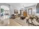 Open-concept living room showcasing neutral tones, an inviting layout, and hardwood floors at 3217 N Piedra Cir, Mesa, AZ 85207