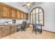 Well-appointed office with custom built-ins, providing ample storage and workspace at 3217 N Piedra Cir, Mesa, AZ 85207