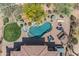 Aerial shot showcasing the pool with a waterfall feature, spa, and plenty of lounge space at 3217 N Piedra Cir, Mesa, AZ 85207