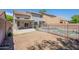 View of covered patio, home, and fenced pool area at 3233 E Sequoia Dr, Phoenix, AZ 85050