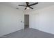 Bright bedroom has carpet flooring and closet storage space at 3233 E Sequoia Dr, Phoenix, AZ 85050