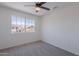 Sunlit bedroom with a large window, providing views of the neighborhood and plenty of natural light at 3233 E Sequoia Dr, Phoenix, AZ 85050