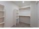 Walk-in closet with built-in shelves and hanging rods for optimal storage and organization at 3233 E Sequoia Dr, Phoenix, AZ 85050
