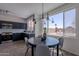 Modern kitchen with stainless steel appliances, blue cabinets, white countertops, view from dining area at 3233 E Sequoia Dr, Phoenix, AZ 85050