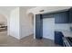 Kitchen with blue cabinets, white countertops, and stainless steel appliances, showcasing a modern design at 3233 E Sequoia Dr, Phoenix, AZ 85050