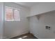 Light and bright laundry room with storage shelves at 3233 E Sequoia Dr, Phoenix, AZ 85050