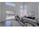 Open living room with sliding glass doors leading to backyard patio at 3233 E Sequoia Dr, Phoenix, AZ 85050