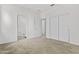 Neutral bedroom offers versatile space with sliding closet doors and an attached bathroom at 325 E Coronado Rd # 8, Phoenix, AZ 85004