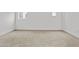 Bedroom features neutral carpet, blank canvas walls and natural light from two windows at 325 E Coronado Rd # 8, Phoenix, AZ 85004