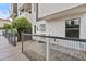 Exterior view of the modern townhome with a gated entryway and small tree at 325 E Coronado Rd # 8, Phoenix, AZ 85004