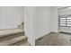 Entryway featuring stairs and access to the garage with modern flooring at 325 E Coronado Rd # 8, Phoenix, AZ 85004