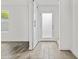 Foyer featuring wood-look tile flooring, and a sliding barn door at 325 E Coronado Rd # 8, Phoenix, AZ 85004