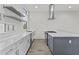 Bright kitchen offers stainless steel appliances, ample counter space, and stylish shelving at 325 E Coronado Rd # 8, Phoenix, AZ 85004