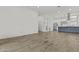 Spacious living room with tile floors leading to a kitchen with stainless steel appliances at 325 E Coronado Rd # 8, Phoenix, AZ 85004