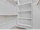 Bright walk-in closet with shelving and hanging rods provides ample storage space at 325 E Coronado Rd # 8, Phoenix, AZ 85004