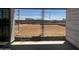 View of an unfinished backyard with a dirt lot from the back porch of a home under construction at 32615 N Newby Dr, San Tan Valley, AZ 85143