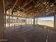 New construction interior framework showing the open space with lumber beams at 32615 N Newby Dr, San Tan Valley, AZ 85143