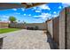 Spacious backyard featuring a paver patio and block wall fence at 338 W Taro Ln, Phoenix, AZ 85027