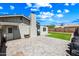 Private backyard features a paver patio and low-maintenance artificial grass at 338 W Taro Ln, Phoenix, AZ 85027