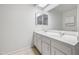Bright bathroom with double sinks and a big mirror at 338 W Taro Ln, Phoenix, AZ 85027