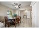 Cozy dining area with wooden table, tile flooring and a ceiling fan at 338 W Taro Ln, Phoenix, AZ 85027