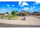 Charming single story home featuring a carport and fenced front yard on a sunny day at 338 W Taro Ln, Phoenix, AZ 85027