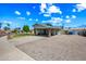 Ranch-style house featuring a large gravel front yard and covered carport at 338 W Taro Ln, Phoenix, AZ 85027