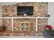 Charming brick fireplace with mantle and decorative screen at 338 W Taro Ln, Phoenix, AZ 85027