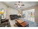 Spacious living room featuring comfortable seating and a large area rug at 338 W Taro Ln, Phoenix, AZ 85027