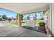 Cozy porch with swing and brick columns, overlooking the front yard at 338 W Taro Ln, Phoenix, AZ 85027