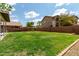Expansive backyard with lush green lawn, offering plenty of space for recreation and outdoor activities at 3730 S Chaparral Rd, Apache Junction, AZ 85119
