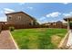 Large backyard with lush green lawn, offering plenty of space for recreation and relaxation at 3730 S Chaparral Rd, Apache Junction, AZ 85119