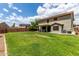 Expansive backyard with well-maintained lawn and privacy fence, perfect for outdoor activities at 3730 S Chaparral Rd, Apache Junction, AZ 85119