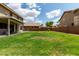 Lush backyard with a covered patio, perfect for enjoying outdoor living and entertaining guests at 3730 S Chaparral Rd, Apache Junction, AZ 85119