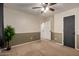 This bedroom has two-tone walls and access to the other rooms at 3730 S Chaparral Rd, Apache Junction, AZ 85119