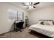 The bedroom offers great natural light and a ceiling fan at 3730 S Chaparral Rd, Apache Junction, AZ 85119