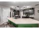 Island kitchen showcasing a stainless sink and appliances, ample cabinetry, and modern lighting at 3730 S Chaparral Rd, Apache Junction, AZ 85119