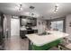 Island kitchen featuring a stainless sink and stainless appliances with an adjacent breakfast area at 3730 S Chaparral Rd, Apache Junction, AZ 85119