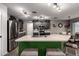 Island kitchen showcasing a stainless sink and appliances with adjacent eat-in dining area at 3730 S Chaparral Rd, Apache Junction, AZ 85119