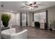 The living room showcases natural light, neutral tones, and a desk area with wood-look floors at 3730 S Chaparral Rd, Apache Junction, AZ 85119