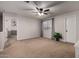 Spacious loft area with carpeting, window, doorway, and ceiling fan at 3730 S Chaparral Rd, Apache Junction, AZ 85119