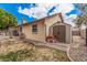 Side view of backyard with shed, offering storage and functionality with low maintenance landscaping at 3756 E Clovis Ave, Mesa, AZ 85206