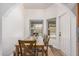 Bright dining area with wood table and chairs near windows overlooking the backyard pool at 3756 E Clovis Ave, Mesa, AZ 85206