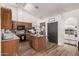 Spacious kitchen featuring wooden cabinetry, center island, and modern appliances at 3756 E Clovis Ave, Mesa, AZ 85206
