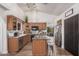 Well-lit kitchen with stainless appliances, granite countertops, and a center island with seating at 3756 E Clovis Ave, Mesa, AZ 85206
