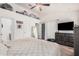 Inviting main bedroom with a ceiling fan, closet, and view of an exterior door at 3756 E Clovis Ave, Mesa, AZ 85206