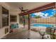 Cozy covered patio with a fan, seating, and views of the sparkling pool for outdoor relaxation at 3756 E Clovis Ave, Mesa, AZ 85206