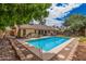 Refreshing pool area with a patio, landscaping, and comfortable seating, perfect for outdoor enjoyment at 3756 E Clovis Ave, Mesa, AZ 85206