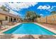 Inviting backyard pool offers a refreshing escape with ample space for relaxation and entertaining at 3756 E Clovis Ave, Mesa, AZ 85206